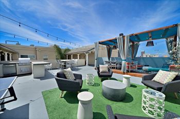Rooftop lounge with cabana, seating areas and community bbqs